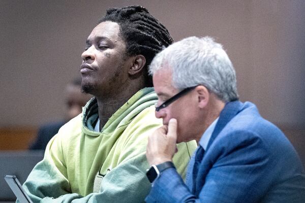 Atlanta rapper Young Thug listens to the judge at the Fulton County Courthouse during jury selection in the “Young Slime Life” gang case with his defense attorney Brian Steel in Atlanta Tuesday, September 12, 2023.  (Steve Schaefer/steve.schaefer@ajc.com)