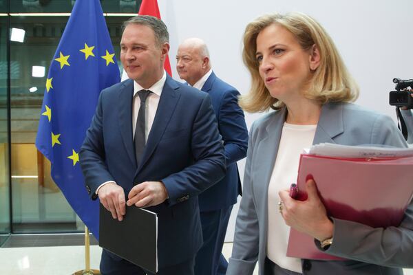 Austrian party leaders Christian Stocker of the Peoples' Party (OeVP), center, Andreas Babler of the Social Democrats (SPOe), left, and Beate Meinl-Reisinger of NEOS, right, leave a news conference after agreeing to form a coalition government in Vienna, Austria, Thursday, Feb 27, 2025. (AP Photo/Heinz-Peter Bader)