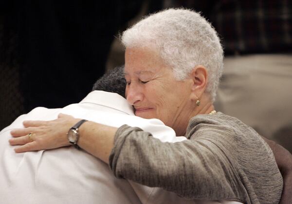 On hearing the verdict, Rita Schwerner Bender, widow of slain civil rights worker Michael Schwerner, hugs Roscoe Jones, who worked with the Schwerners in 1964. (AP Photo/Rogelio Solis)