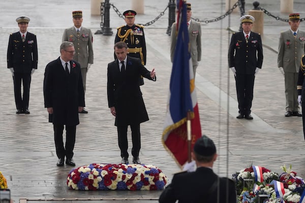 French President Emmanuel Macron and British Prime Minister Keir Starmer, left, attend ceremonies marking the 106th anniversary of the Armistice, a celebration of their countries' friendship, as nations across the world pay tribute to their fallen soldiers in World War I, Monday, Nov. 11, 2024 in Paris, (AP Photo/Michel Euler, Pool)