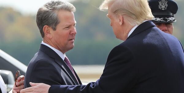 Gov. Brian Kemp greeted then-President Donald Trump at Dobbins Air Reserve Base in Marietta in 2019. 