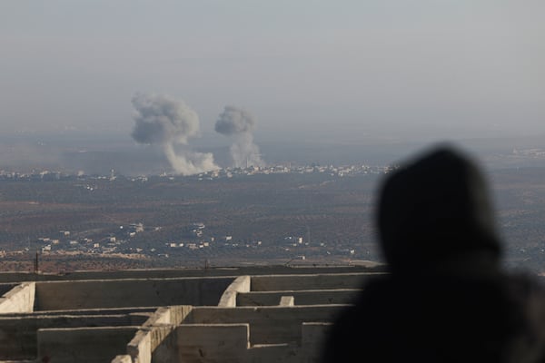 Smoke rises amid fighting between opposition factions and Syrian government troops in Majdaliya, Aleppo countryside, Syria, Thursday, Nov. 28, 2024. (AP Photo/Ghaith Alsayed)