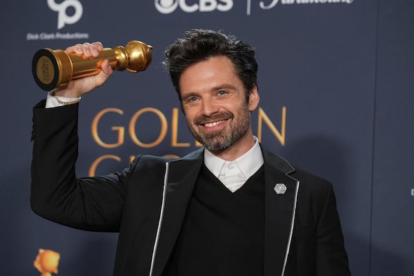 Sebastian Stan poses in the press room with the award for best performance by a male actor in a motion picture - musical or comedy for "A Different Man" during the 82nd Golden Globes on Sunday, Jan. 5, 2025, at the Beverly Hilton in Beverly Hills, Calif. (AP Photo/Chris Pizzello)