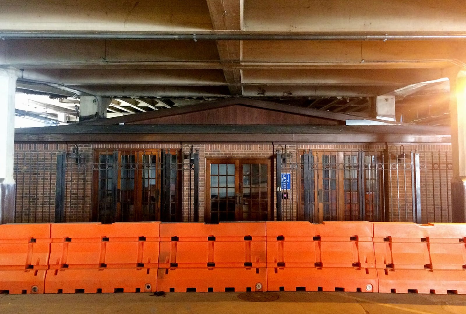 This building beneath the Central Avenue viaduct was built around the Zero Mile Post landmark in downtown Atlanta in the late 1980s. According to the Georgia Building Authority, which owns the building, the demolition is necessary in order to replace two downtown bridges. The post is one of Atlanta’s oldest landmarks and has stood in place since 1850. (PETE CORSON / pcorson@ajc.com)