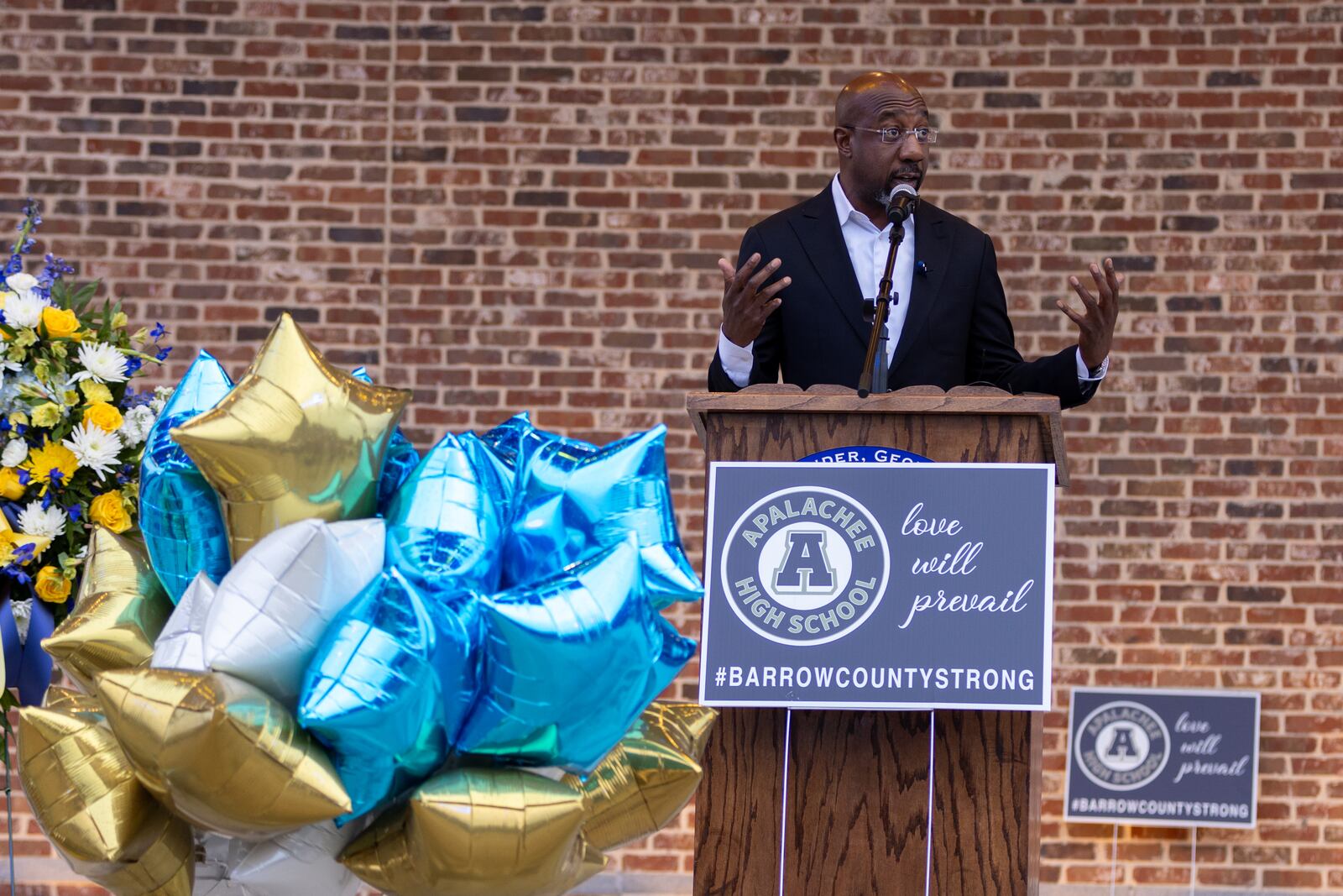 U.S. Sen. Raphael Warnock, an Atlanta Democrat, speaks at a vigil in Winder for the four victims fatally shot at Apalachee High School last week.