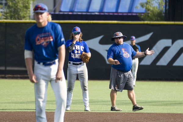 “To me, the part that she is a woman was not part of the equation. I saw a baseball player who wanted to play,” Georgia Highlands College baseball coach Dash O’Neill says of redshirt freshman Ashton Lansdell. Here, he’s speaking to Ashton during a baseball intrasquad scrimmage on Sept. 26, 2019. ALYSSA POINTER / ALYSSA.POINTER@AJC.COM