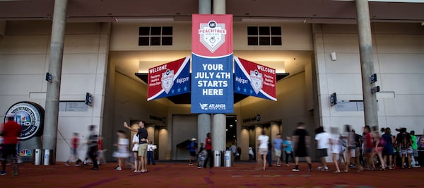 People mill around outside the Peachtree Health and Fitness Expo at the Georgia World Congress Center in Atlanta on Saturday, July 2, 2016. STEVE SCHAEFER / SPECIAL TO THE AJC