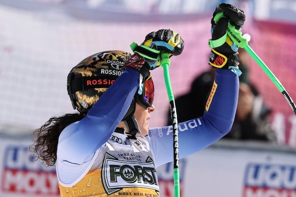 Italy's Federica Brignone reacts after completing an alpine ski, women's World Cup super G race, in La Thuile, Italy, Thursday, March 13, 2025. (AP Photo/Marco Trovati)