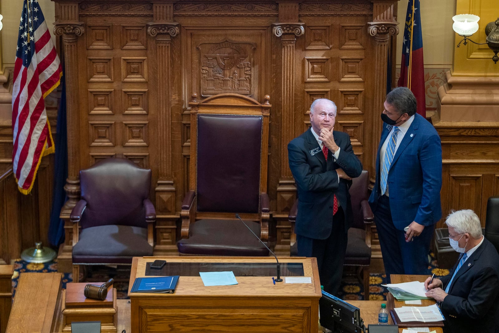 Republican state Sen. Steve Gooch of Dahlonega, right, speaks with Senate President Pro Tem Butch Miller, R-Gainesville, as Miller presides over the Senate during a debate at the Georgia Capitol. Miller took the gavel after Lt. Gov. Geoff Duncan excused himself from the debate because he opposed rolling back absentee voting in Georgia. (Alyssa Pointer / Alyssa.Pointer@ajc.com)