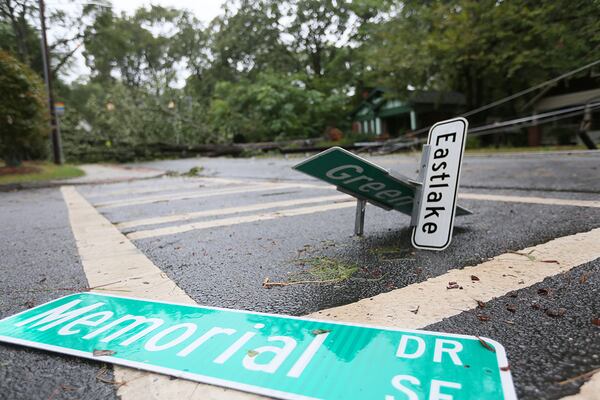 A street sign lies in the road at a DeKalb County intersection Tuesday after Irma passed through Atlanta as a tropical storm the night before.