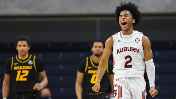 Auburn guard Sharife Cooper (2) celebrates a Missouri turnover in the final seconds of an NCAA college basketball game Tuesday, Jan. 26, 2021, in Auburn, Ala.