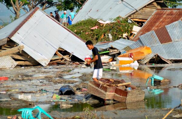 A man surveys the damage caused by an earthquake and tsunami in Palu, Central Sulawesi in Indonesia on Saturday.