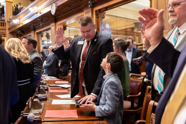 Georgia State representatives, including Will Wade, a Republican from Dawsonville, are sworn in on the first day of the legislative session at the Capitol in Atlanta on Monday.