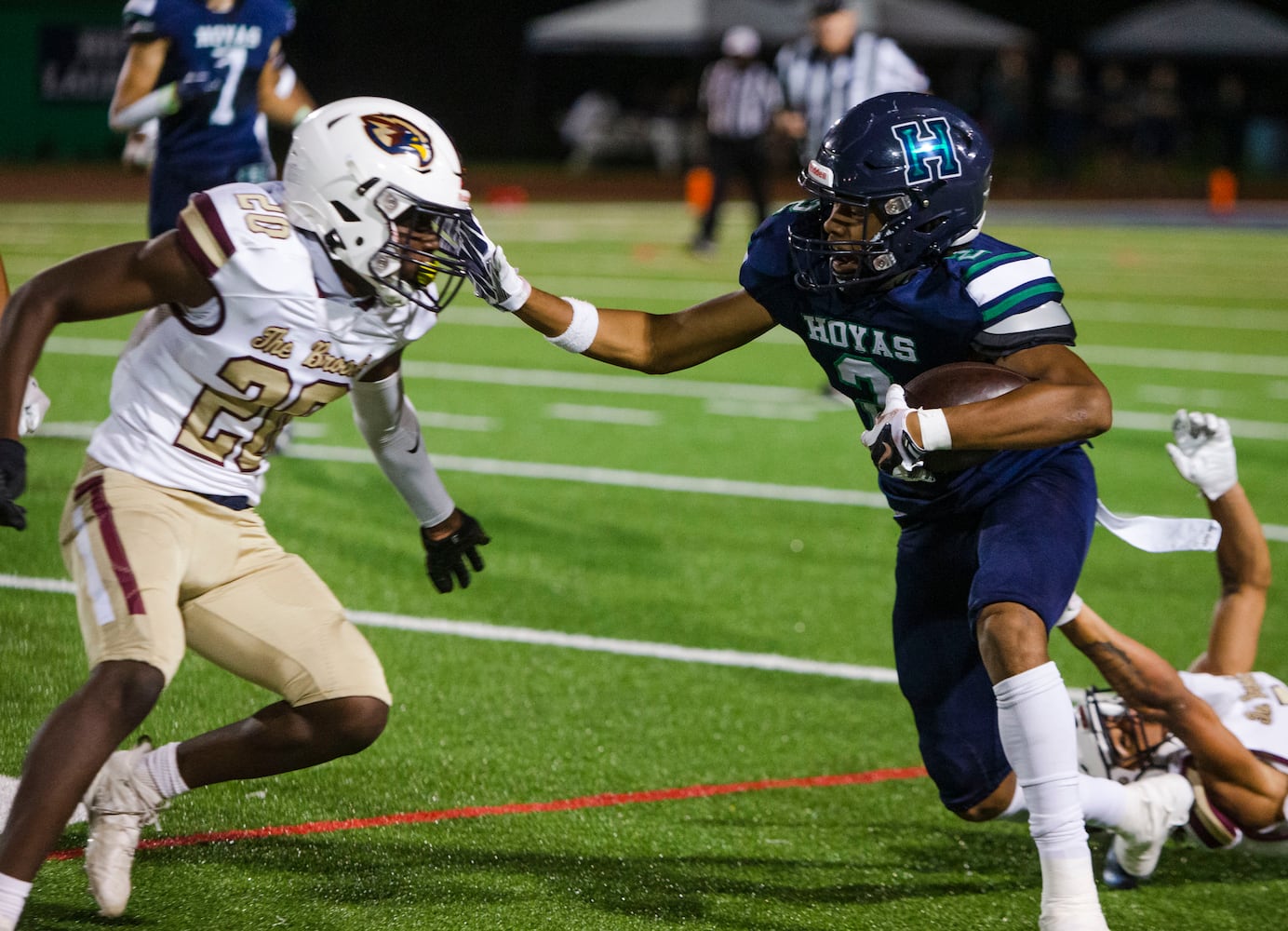 Reggie Brigman, wide receiver for Harrison, strong arms Nick Valerio, corner back for Pebblebrook, during the Harrison vs. Pebblebrook high school football game on Friday, September 23, 2022, at Harrison high school in Kennesaw, Georgia. Pebblebrook defeated Harrison 31-14. CHRISTINA MATACOTTA FOR THE ATLANTA JOURNAL-CONSTITUTION.