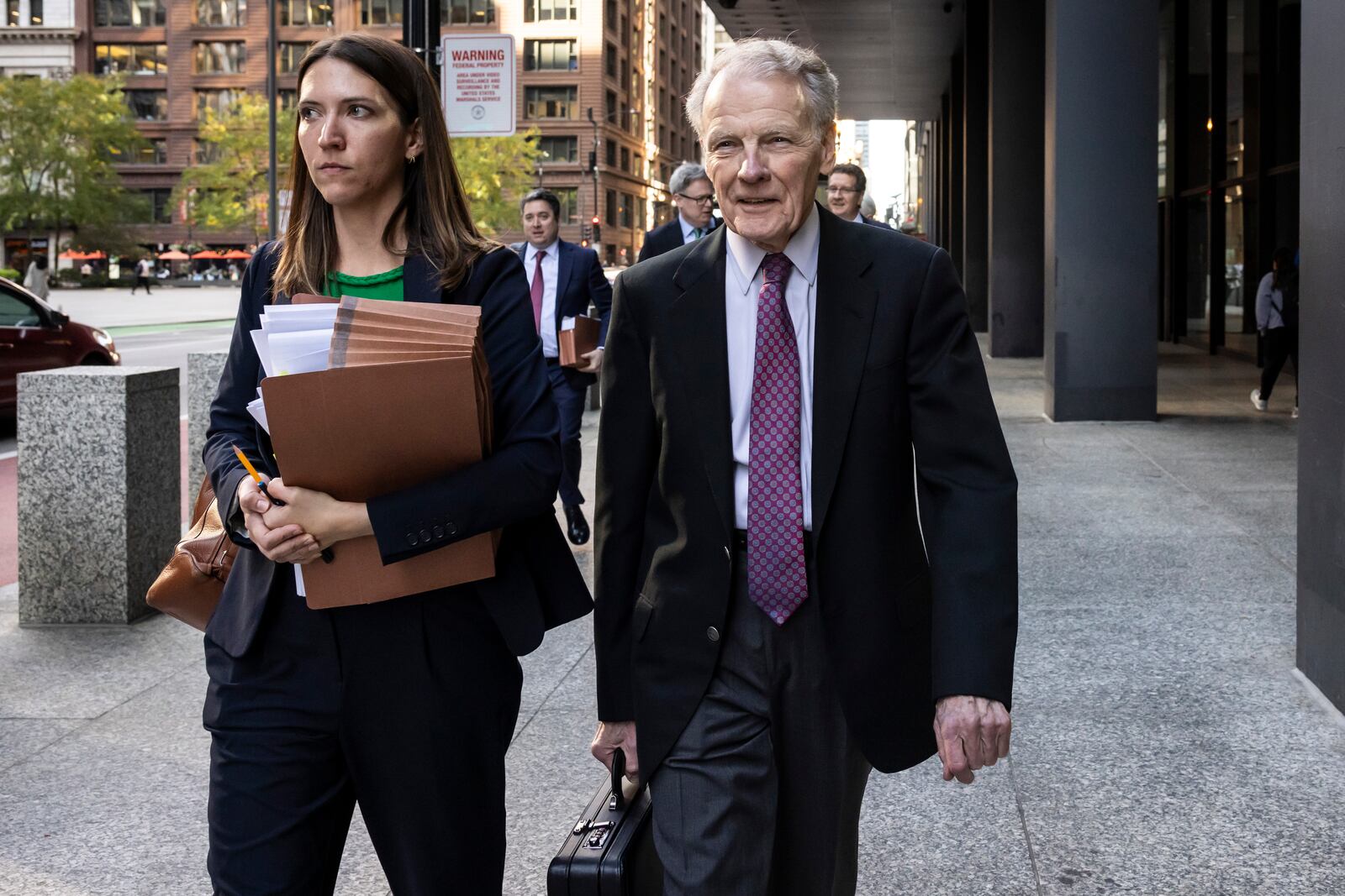 Illinois' former House Speaker Michael Madigan, charged in a multimillion-dollar racketeering and bribery scheme that included the state’s largest utility, ComEd, walks out of the Dirksen Federal Courthouse, Wednesday, Oct. 9, 2024 in Chicago. (Ashlee Rezin/Chicago Sun-Times via AP)