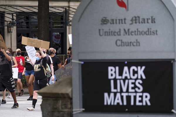 A large group of demonstrators march from the Martin Luther King center toward Piedmont park June 6, 2020, as protests continued in Atlanta. Protests over the death of George Floyd in Minneapolis police custody continued around the United States, as his case renewed anger about others involving African Americans, police and race relations. BEN GRAY FOR THE ATLANTA JOURNAL CONSTITUTION