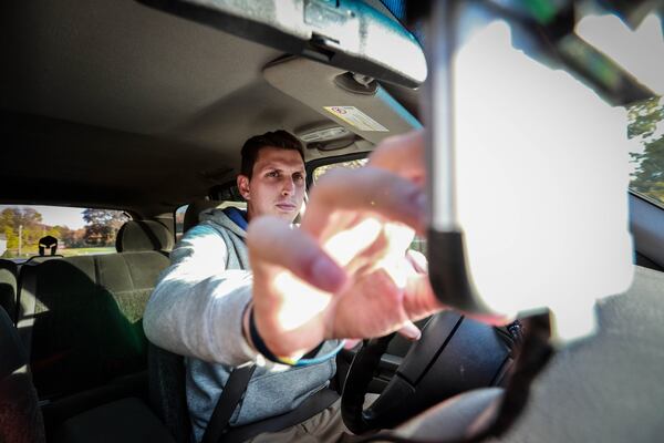 Brett Hudson from Jackson, Mich. drives a 2002 Chevy Trailblazer, Nov. 1, 2016. To reduce the time he looks at the phone, Hudson installed an aftermarket Bluetooth system for hands-free phone calls. (Fabrizio Costantini/The New York Times)