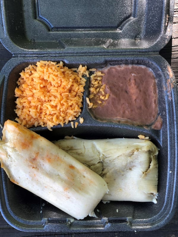 A tamale plate at La Mixteca in Suwanee includes wonderful Mexican rice and refried beans. Shown here are the red chicken and green chicken tamales. CONTRIBUTED BY WENDELL BROCK