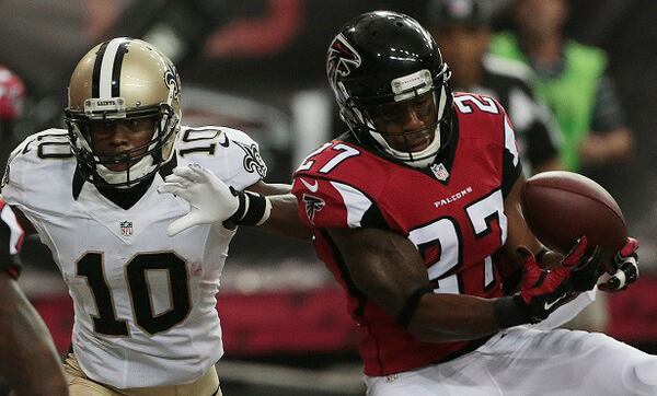 Atlanta Falcons cornerback Robert McClain (27) makes a catch for an interception as the intended receiver New Orleans Saints wide receiver Brandin Cooks (10) looks on during the second half of an NFL football game, Sunday, Sept. 7, 2014, in Atlanta. (AP Photo/John Bazemore) Somebody's going to win this division. Just not anybody any good. (Curtis Compton/AJC photo)