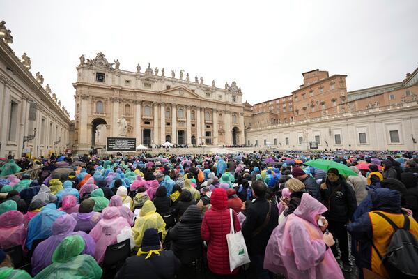 Participants in a mass for the jubilar pilgrims from Naples wait for the start of the celebration on a rainy day in St. Peter's Square at The Vatican, Saturday, March 22, 2025, while Pope Francis is being treated for bilateral pneumonia at Rome's Agostino Gemelli Polyclinic since Feb. 14. (AP Photo/Andrew Medichini)