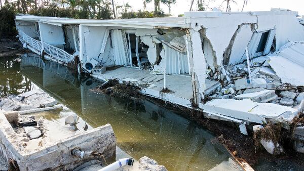 A 3-story building on Islamorada-- 12 units in 2 stories with a parking garage underneath, is collapsed into itself after Hurricane Irma Tuesday, September 12, 2017.  The storm surge passed over the area and apparently caused the building to collapse. (Lannis Waters / The Palm Beach Post)