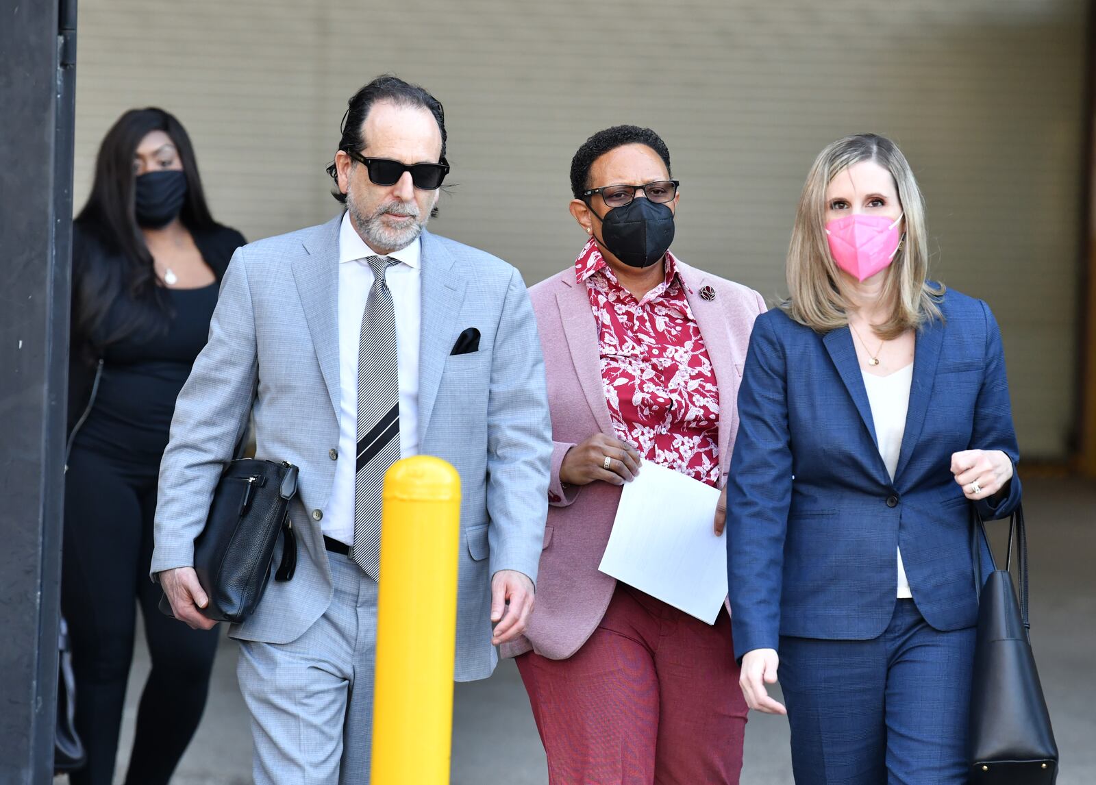 Mitzi Bickers leaves court with her attorney, Drew Findling (left), after a hearing at the Richard B. Russell Federal Building on Thursday, March 3, 2022. (Hyosub Shin / Hyosub.Shin@ajc.com)