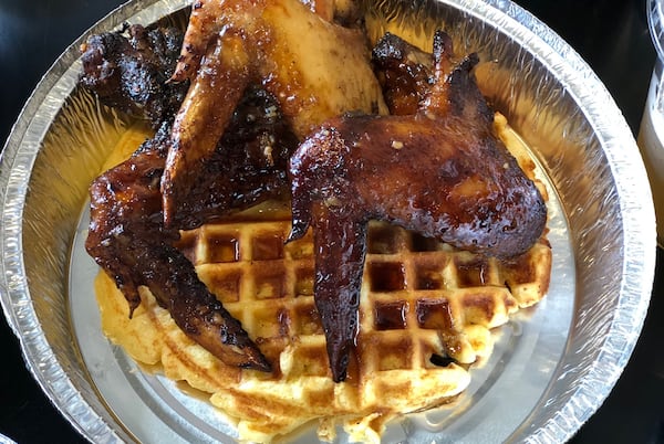 Annie Mae’s Pantry serves smoked wings and several kinds of waffles. This is the hush-puppy waffle, made with cornmeal batter. CONTRIBUTED