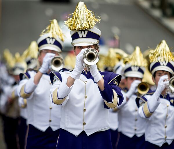 Washington Huskies marching band heads down John Portman Blvd. during the Chick-fil-A Peach Bowl parade Saturday, December 31, 2016, in Atlanta Ga. STEVE SCHAEFER / SPECIAL TO THE AJC