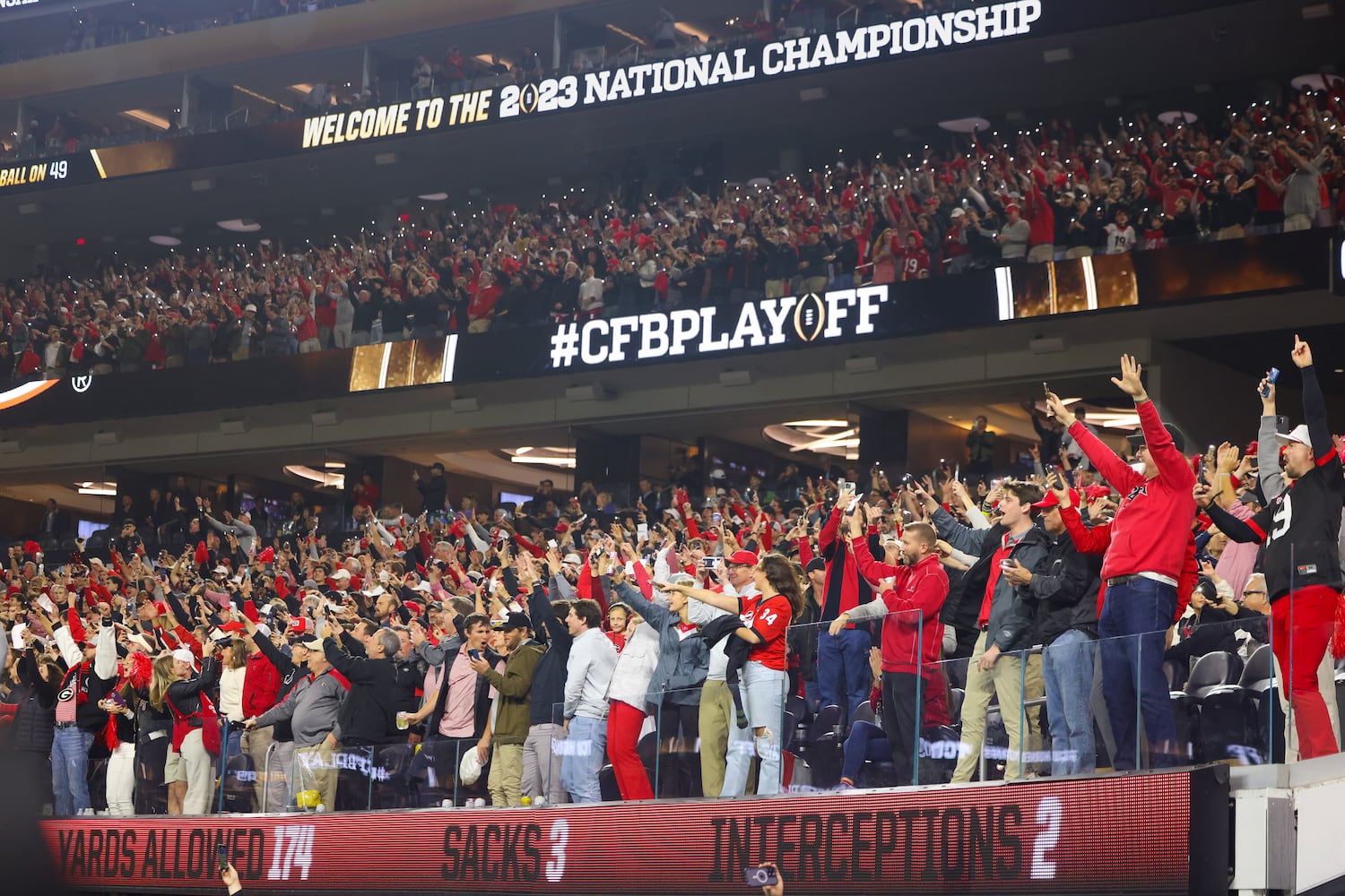 Georgia Bulldogs fans react after a scored against the TCU Horned Frogs during the second half of the College Football Playoff National Championship at SoFi Stadium in Los Angeles on Monday, January 9, 2023. Georgia won 65-7 and secured a back-to-back championship. (Jason Getz / Jason.Getz@ajc.com)