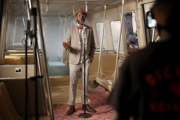 Local author, poet, and storyteller Jon Goode performs as the NEXT Movement films local artists and musicians on a MARTA train at MARTA’s Railyard, Tuesday, July 12, 2022, in Atlanta. (Jason Getz / Jason.Getz@ajc.com) 