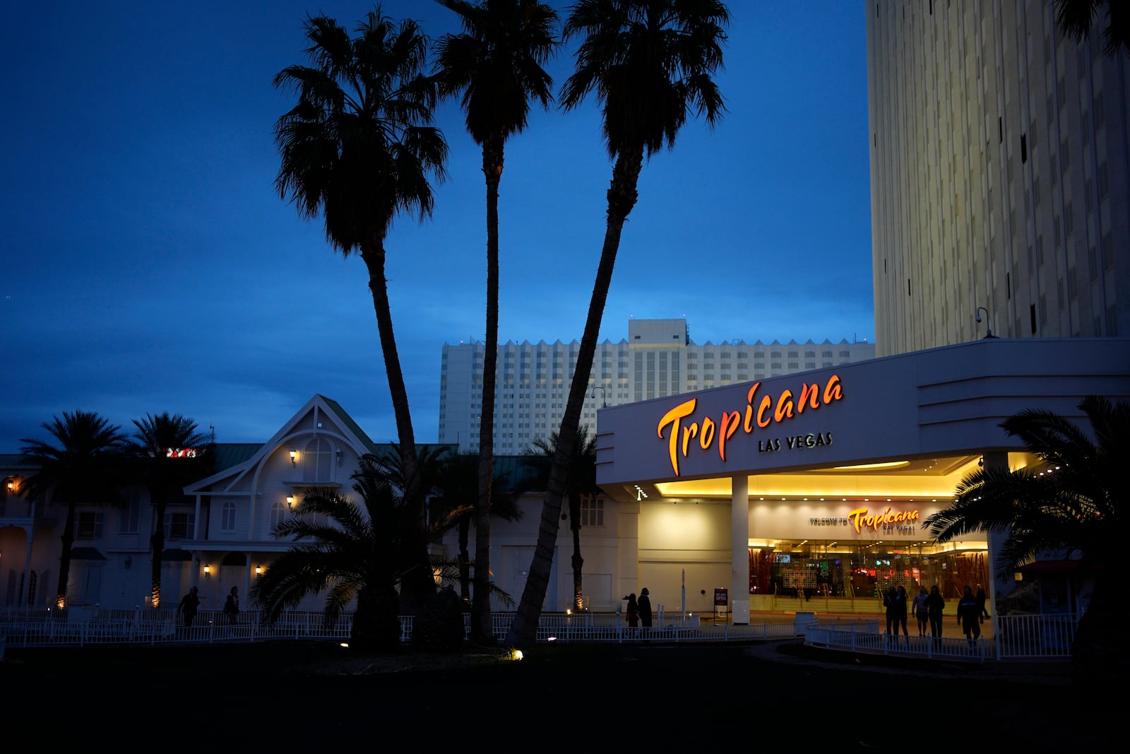 FILE - People walk outside of the Tropicana hotel-casino Thursday, March 28, 2024, in Las Vegas. (AP Photo/John Locher, File)