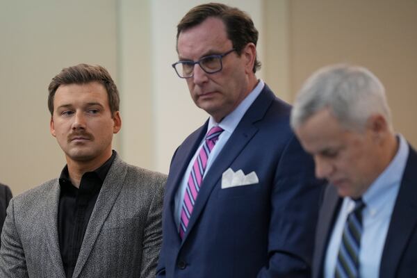 Morgan Wallen, left, listens to his reckless endangerment charges as he pleas guilty to throwing a chair off a six-story balcony in criminal court Thursday, Dec. 12, 2024, in Nashville, Tenn. (AP Photo/George Walker IV)