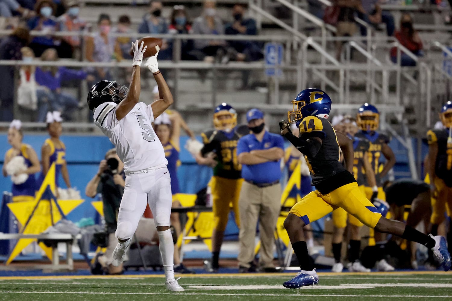 Alpharetta wide receiver Jaden Slocum (5) catches a long pass for a touchdown against Chattahoochee defensive back Tim Reed (14) in the second half at Chattahoochee high school Friday, September 25, 2020 in Johns Creek, Ga.. Alpharetta won 21-7. JASON GETZ FOR THE ATLANTA JOURNAL-CONSTITUTION