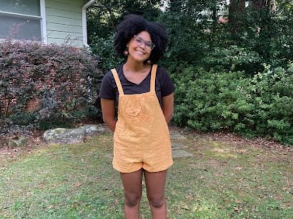 Basil Ghezzi, a junior at Druid Hills High School, is excited to wear outfits like this one to school this year, thanks to new changes to the DeKalb County School District's dress code. The updates remove a requirement for shorts and skirts to be "mid-thigh" and a requirement for all shirts to have sleeves, among other changes. (Courtesy of Basil Ghezzi)