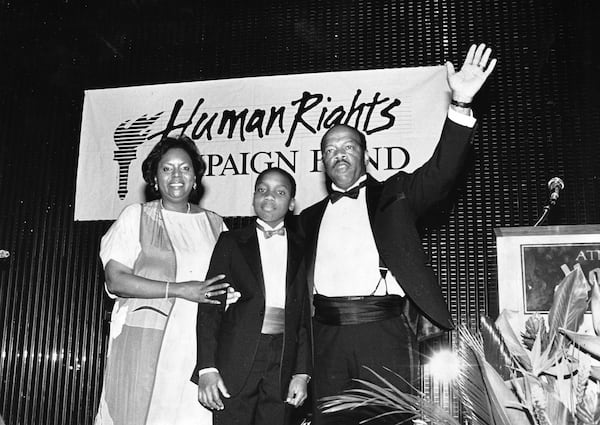 In this 1988 photo, U.S. Rep. John Lewis, with his wife Lillian and son John-Miles (then 11), is honored at a fundraiser for the Human Rights Campaign Fund.