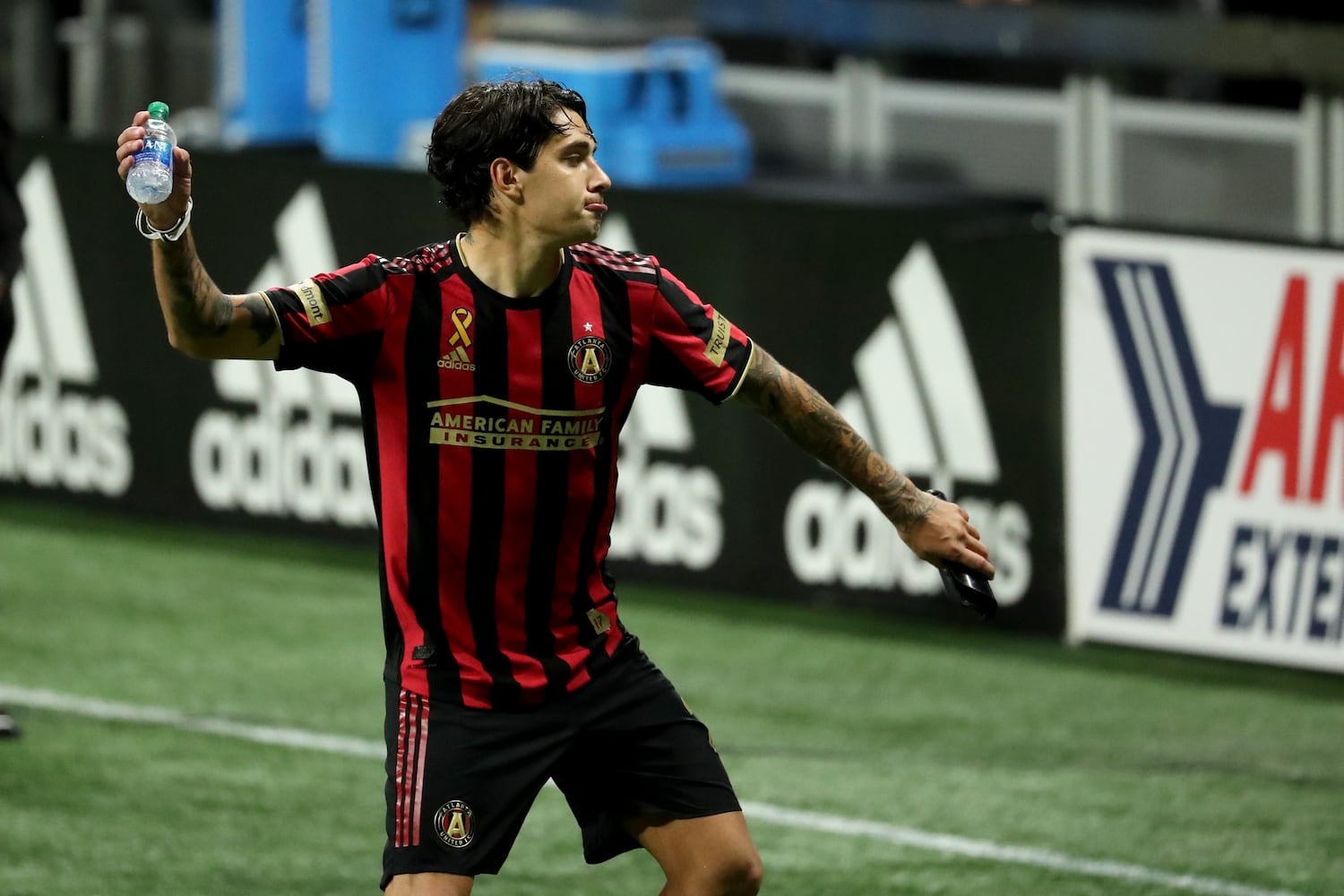 Atlanta United defender Franco Escobar throws a water bottle in frustration after their 2-1 loss to Miami at Mercedes-Benz Stadium Saturday, September 19, 2020 in Atlanta. JASON GETZ FOR THE ATLANTA JOURNAL-CONSTITUTION