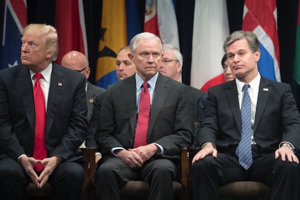 President Donald Trump (from left), Attorney General Jeff Sessions and FBI Director Christopher Wray attend an event at FBI headquarters in Quantico, Va., on Dec. 15, 2017.  Andrew McCabe abruptly stepped down on Jan. 29, 2018, as the FBI's deputy director after months of withering criticism from Trump, telling friends he felt pressure from Wray to leave, according to two people close to Mr. McCabe. (Photo: Tom Brenner/The New York Times)