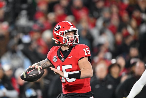 Georgia quarterback Carson Beck (15) prepares to throw during the first half in an NCAA football game at Sanford Stadium, Friday, November 29, 2024, in Athens. (Hyosub Shin / AJC)