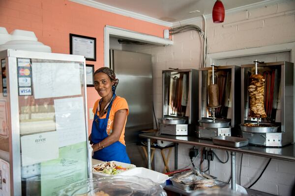 Merhaba Shawarma owner Manna Samuel, an Eritrean, prepares a shawarma plate. CONTRIBUTED BY MIA YAKEL