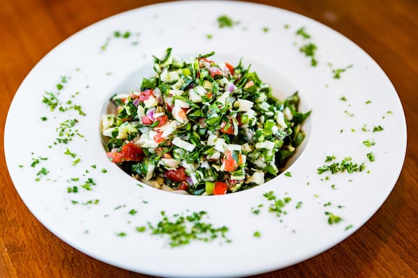 Raw collard green and cabbage salad at Feedel Bistro. CONTRIBUTED BY HENRI HOLLIS