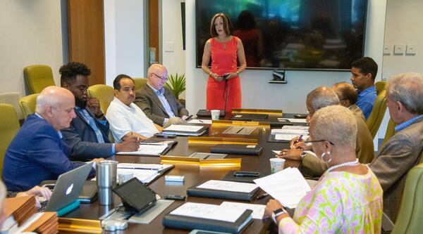 A presentation is made to board members of the Development Authority of Fulton County during a meeting in August 2019 at the Fulton County Government Center in Atlanta. School leaders and the city’s development authority want Fulton County to stop handing out tax breaks to development projects located in the city. (Photo by Phil Skinner)