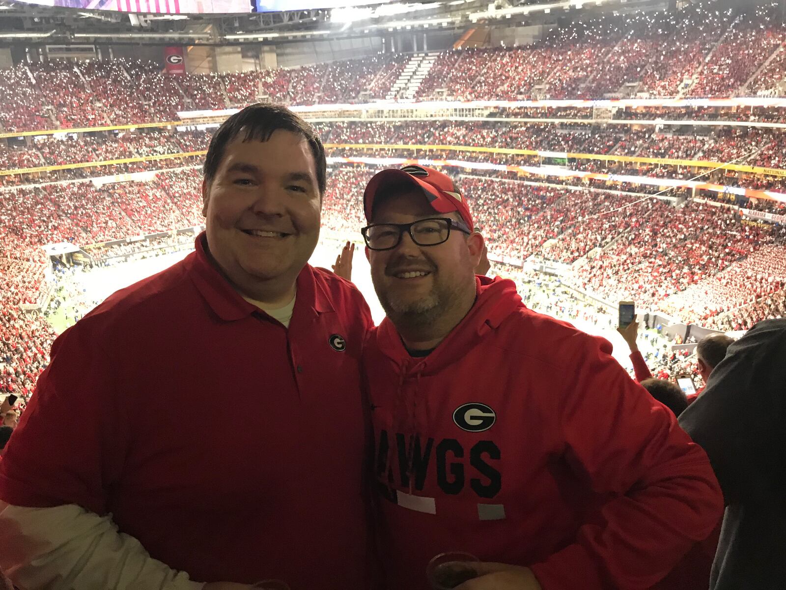  Warren Thomas, left, and Rob Lockery made it inside Mercedes-Benz Stadium after a two-hour wait to get through security.