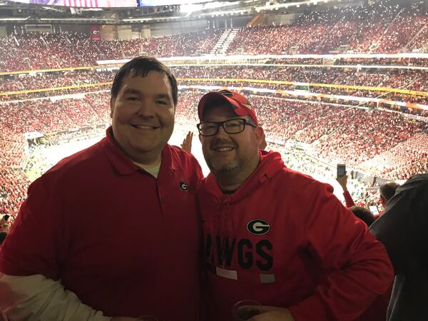  Warren Thomas, left, and Rob Lockery made it inside Mercedes-Benz Stadium after a two-hour wait to get through security.