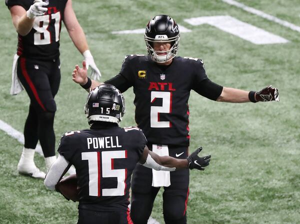 Falcons quarterback Matt Ryan and wide receiver Brandon Powell celebrate Powell’s touchdown reception against the Las Vegas Raiders during the third quarter Sunday, Nov. 29, 2020, at Mercedes-Benz Stadium in Atlanta. (Curtis Compton / Curtis.Compton@ajc.com)