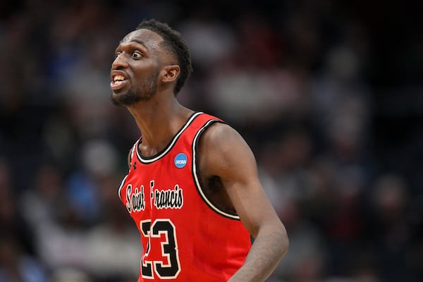 Saint Francis guard Wisler Sanon II reacts during the second half of a First Four college basketball game against Alabama State in the NCAA Tournament, Tuesday, March 18, 2025, in Dayton, Ohio. (AP Photo/Jeff Dean)