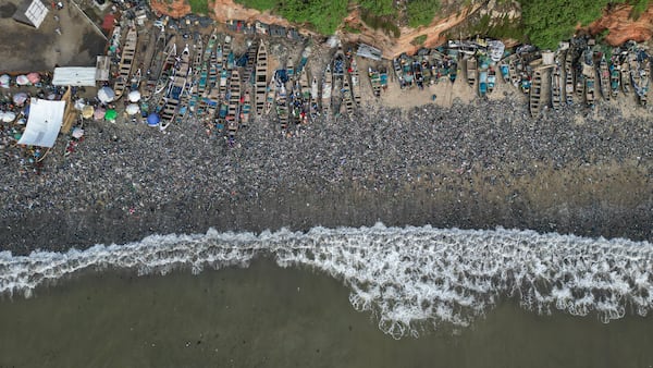 Textile waste pollutes the beach shore at Jamestown in Accra, Ghana, Saturday, Oct. 19, 2024. (AP Photo/Misper Apawu)