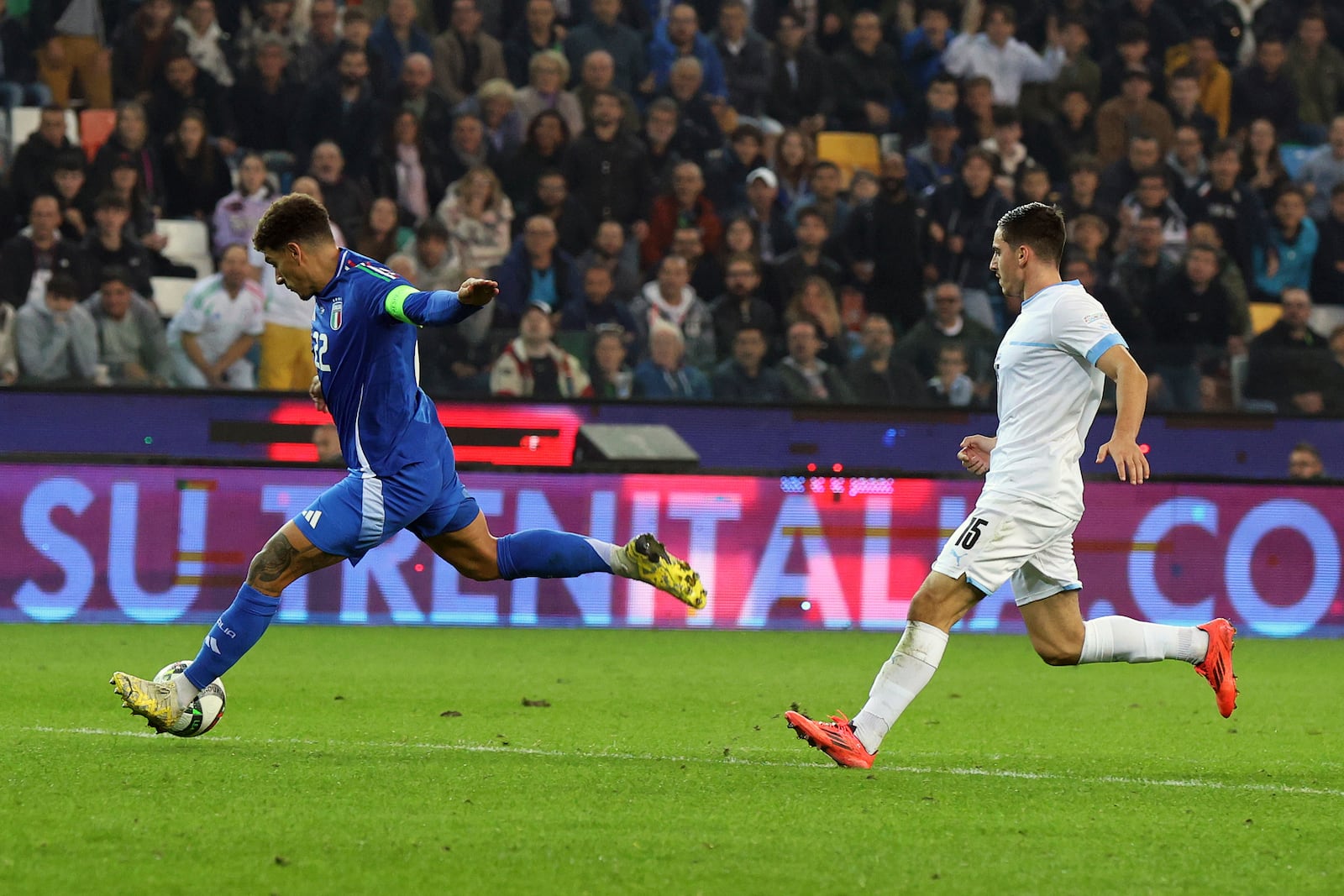 Italian's Giovanni di Lorenzo scores his side's fourth goal during the UEFA Nations League soccer match between Italia and Israel at the Bluenergy Stadium in Udine, Italy, Monday, Oct. 14, 2024. (Andrea Bressanutti/LaPresse via AP)