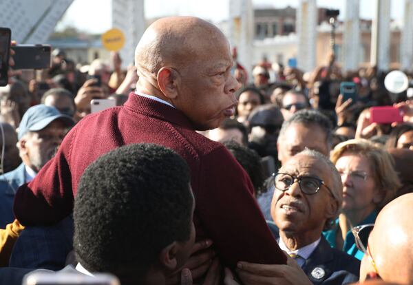 SELMA, ALABAMA - MARCH 01:  Rep. John Lewis (D-GA) is held aloft by Rev. Al Sharpton and others as he speaks to the crowd at the Edmund Pettus Bridge crossing reenactment marking the 55th anniversary of Selma's Bloody Sunday on March 1, 2020 in Selma, Alabama. Mr. Lewis marched for civil rights across the bridge 55 years ago. Some of the 2020 Democratic presidential candidates attended the Selma bridge crossing jubilee ahead of Super Tuesday. (Photo by Joe Raedle/Getty Images)