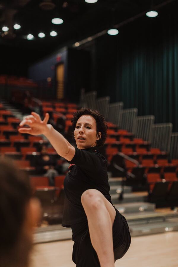 Hillmer demonstrating movement at an ImmerseATL rehearsal.