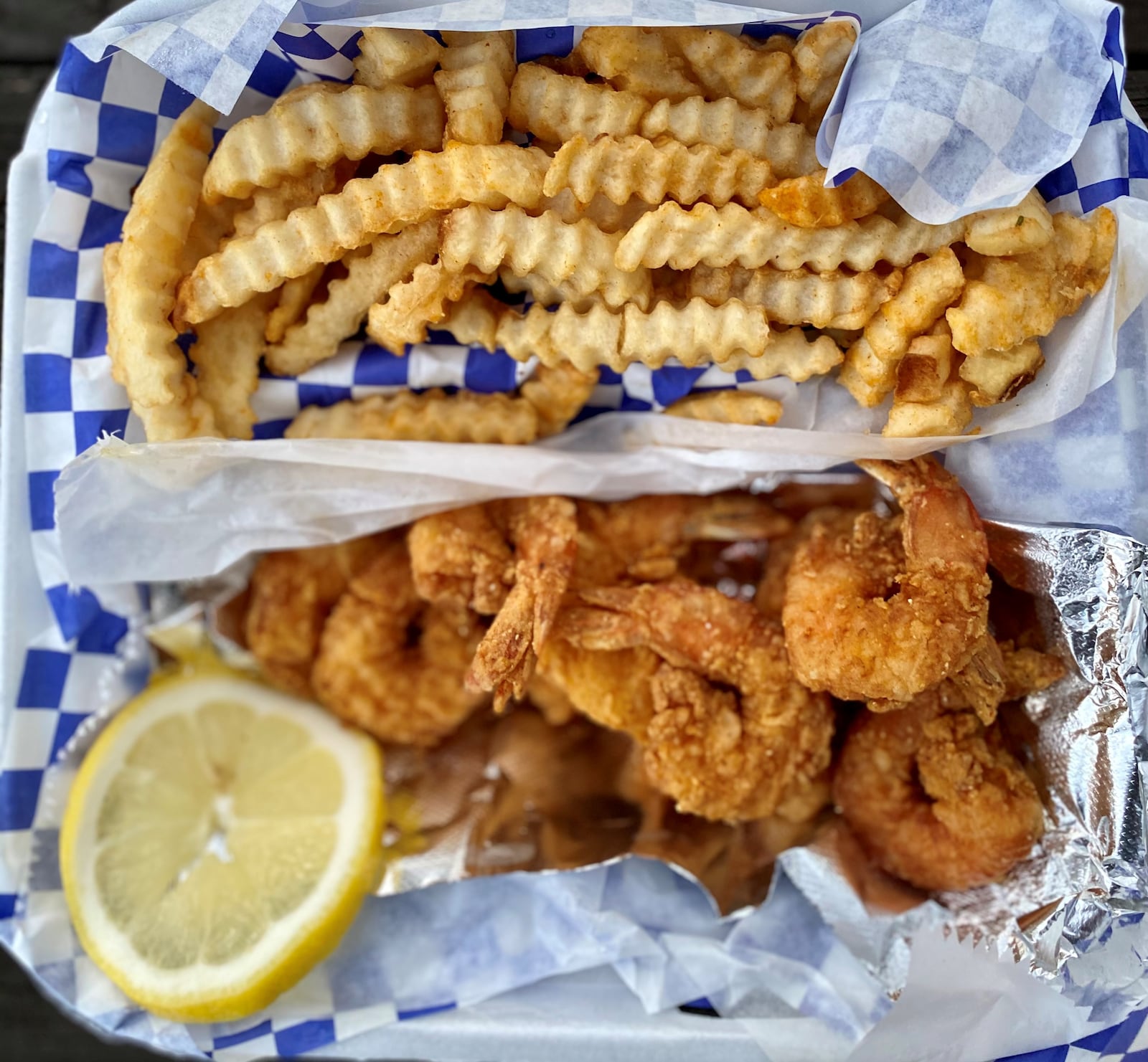 Kelz Kitchen knows how to fry shrimp; this is the shrimp basket with fries. Wendell Brock for The Atlanta Journal-Constitution